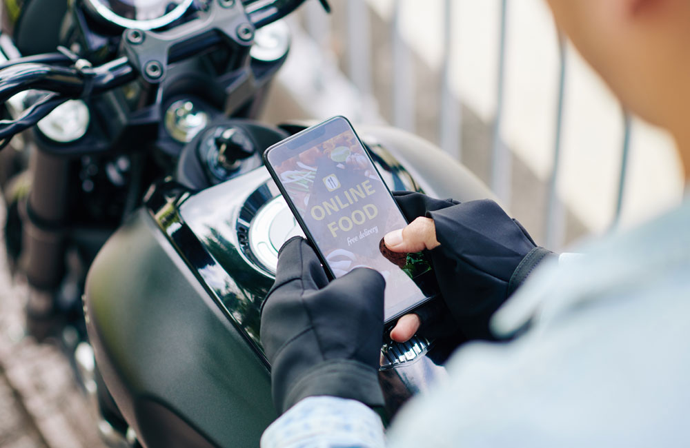motorcyclist-ordering-food-using-online ordering-system-foodship